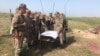 Kazakhstan -- Military cadets being instructed outdoors. A training field.