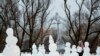 RUSSIA CHRISTMAS HOLIDAYS -- A girl makes snowmen during the Christmas holidays in Aviator’s Park in St. Petersburg, Russia, 05 January 2022. Russians celebrate the Christmas which is observed on 07 January according to the Russian Orthodox Julian calenda