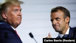 Trump (solda) Fransa prezidenti Macron-un bir sıra diplomatik təşəbbüslərinin ardınca qarşıdan gələn həftələrdə iranlı həmkarı ilə görüşə biləcəyini deyib