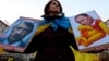 Czech Republic – Protestor holds anti Putin banner during a rally in protest against the Russian military actions in Crimea, in Prague, Czech Republic, 08 March 2014